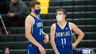 Snowflake Lobo Seniors Stewart West #24 and Gannon Larson #11 talk during the Snowflake vs Show Low Game on January 26, 2021. Snowflake beat Show Low 56-47.