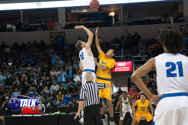 6'3 Harley Upton of Alchesay jumps against 6'8 Jared Perry of Paradise Honors to start the 2A State Semifinals at the Prescott Valley Events Center. The Falcons upset PH 67-61.