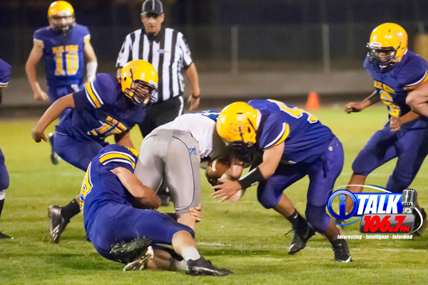The Yellowjackets tackle a Snowflake runner during the Snowflake vs Blue Ridge game on 9/28/18.