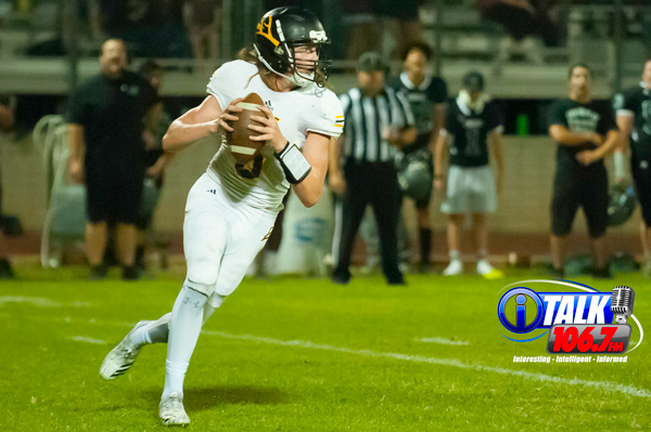 Round Valley Quarterback Kason Woolf drops back to pass during the Elks overtime victory (28-21) over the Cougars of Phoenix Christian High School on September 21st, 2018