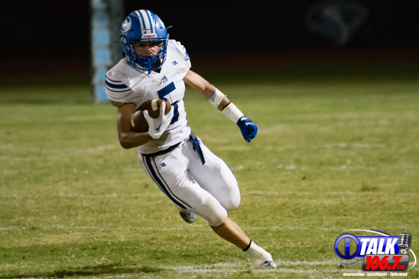 Karter Raban runs the football for Snowflake High School in their game against Cactus