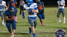 Brenner Green carries thd ball for the Snowflake Lobos in last years Poston Butte Game. Photo Credit: iTalk Sports - Camden Smith