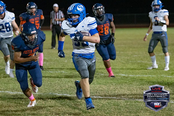 Brenner Green carries thd ball for the Snowflake Lobos in last years Poston Butte Game. Photo Credit: iTalk Sports - Camden Smith